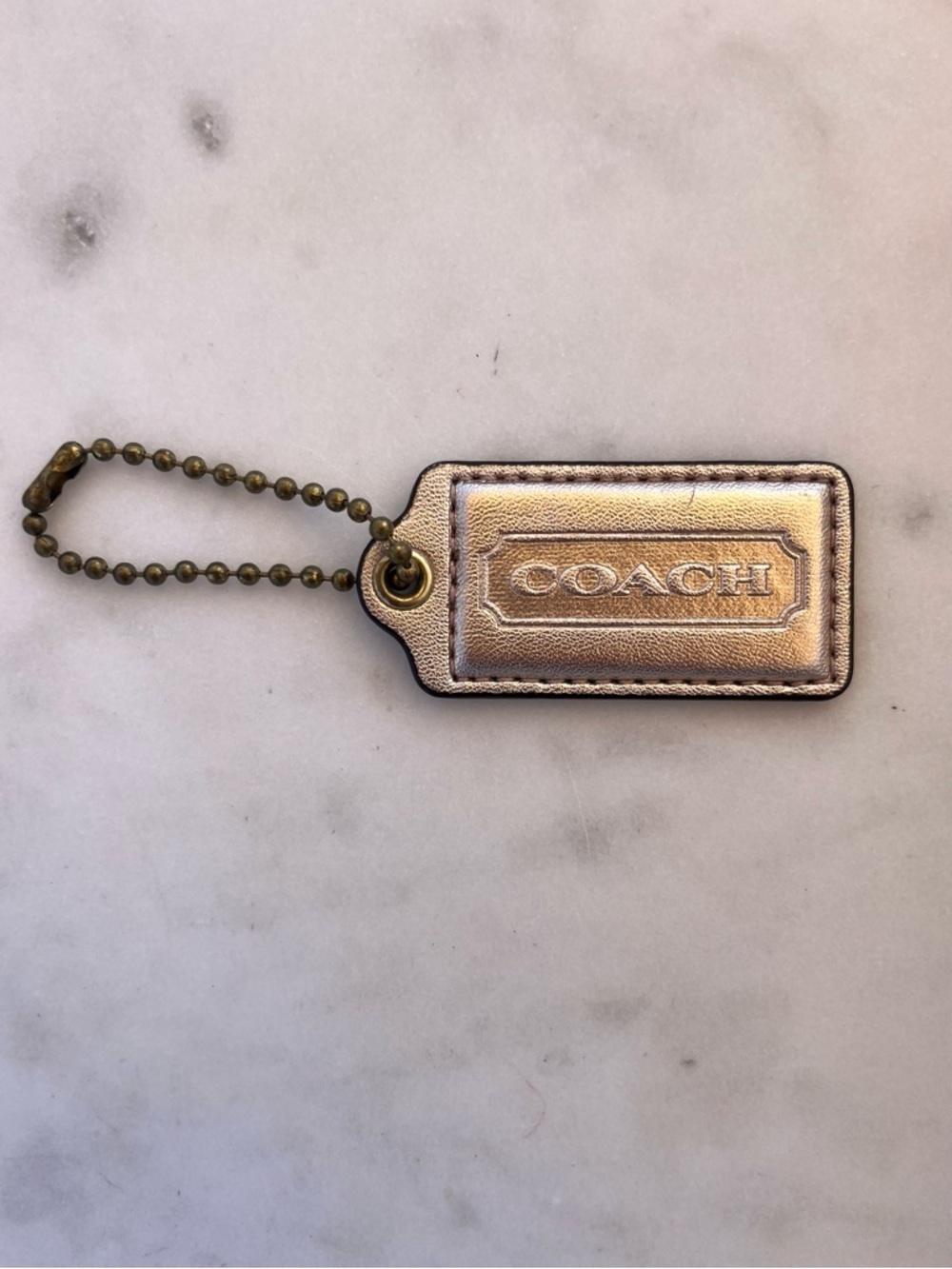 COACH Vintage Metallic Leather Hang Tag, Light Gold - Picture 1 of 3